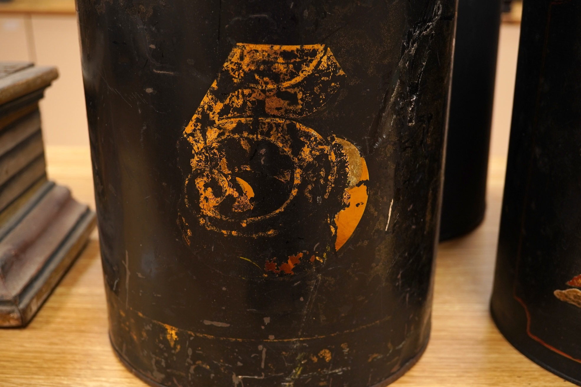 Five 19th century toleware tea canisters, largest 43cm